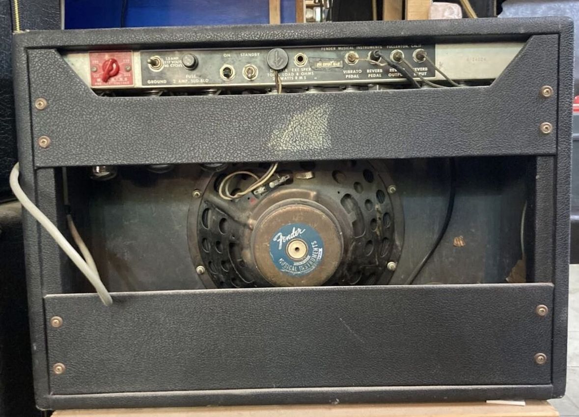 Rear panel open showing back controls, speaker, and doghouse cap area
