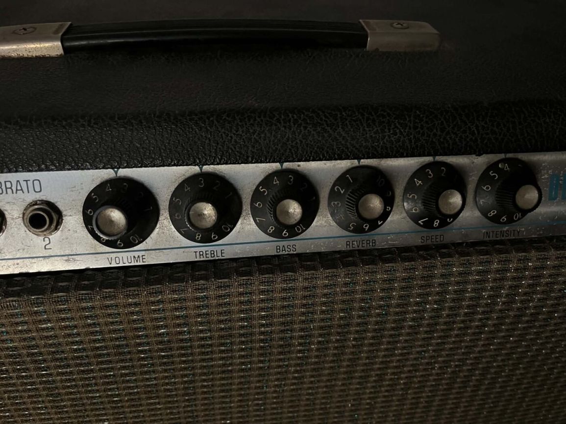 Close-up of the Vibrato channel Volume, Treble, Bass, Reverb, Speed, and Intensity knobs