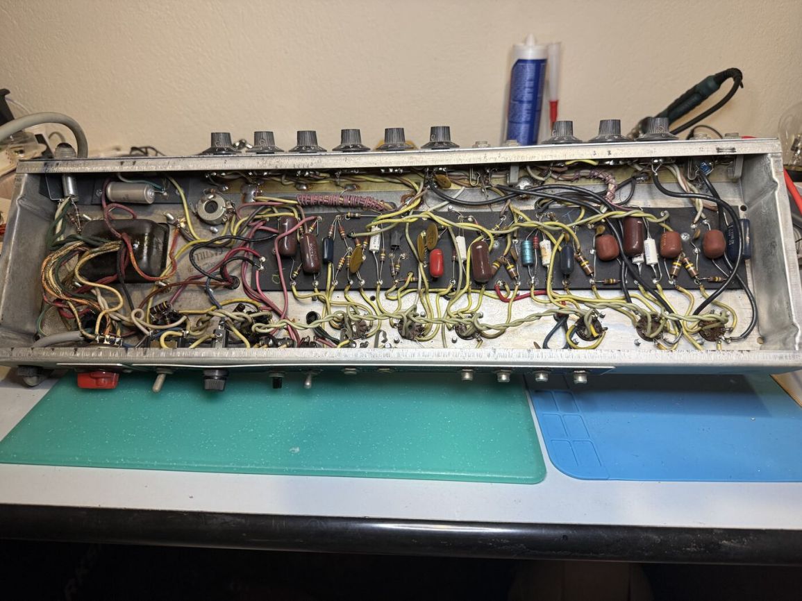 Wide shot of the eyelet board wiring before any repair work