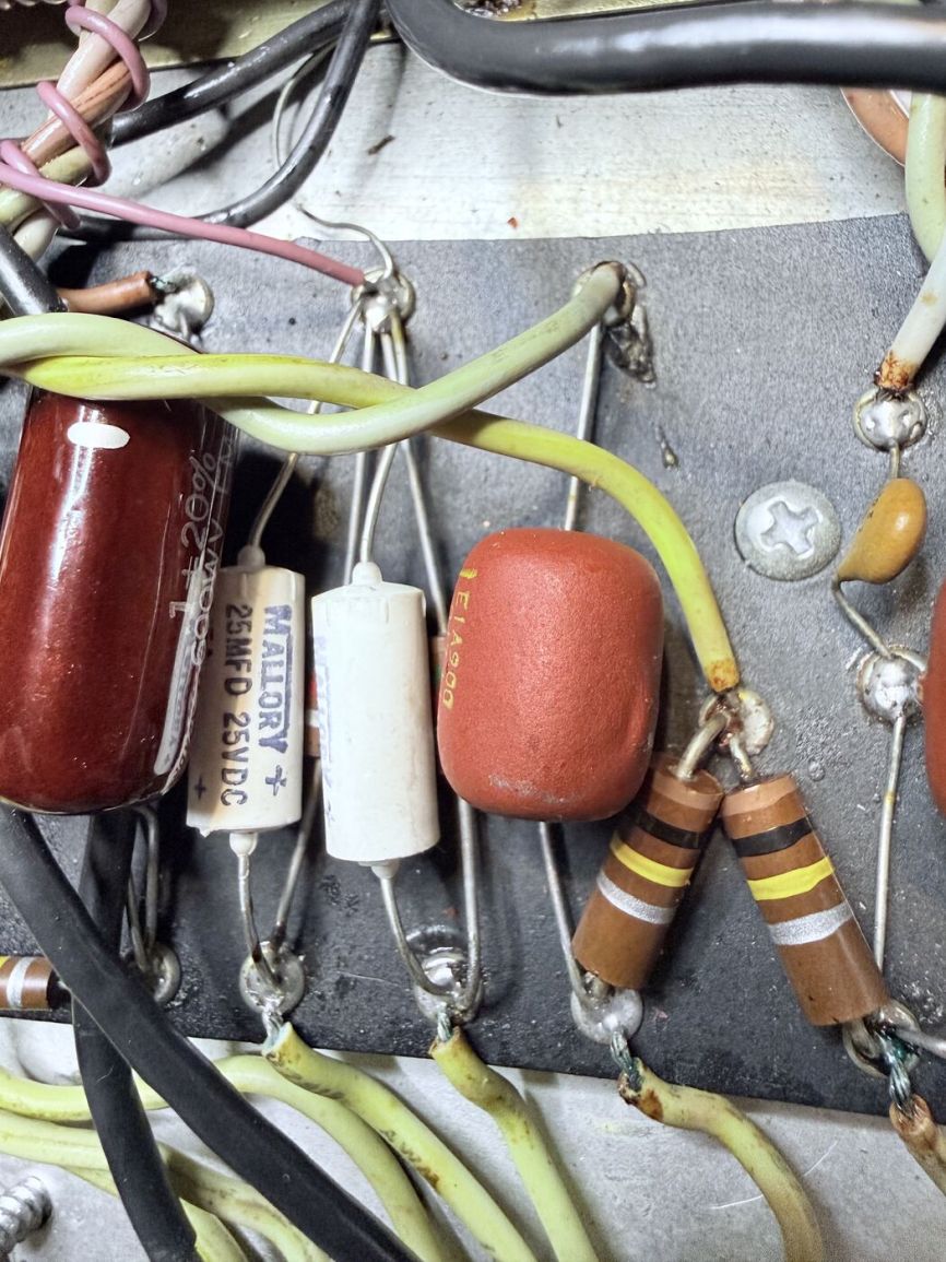Close-up of Mallory capacitors and mismatched resistors on the eyelet board