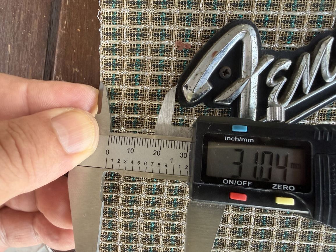 Second caliper measurement near the badge mounting holes