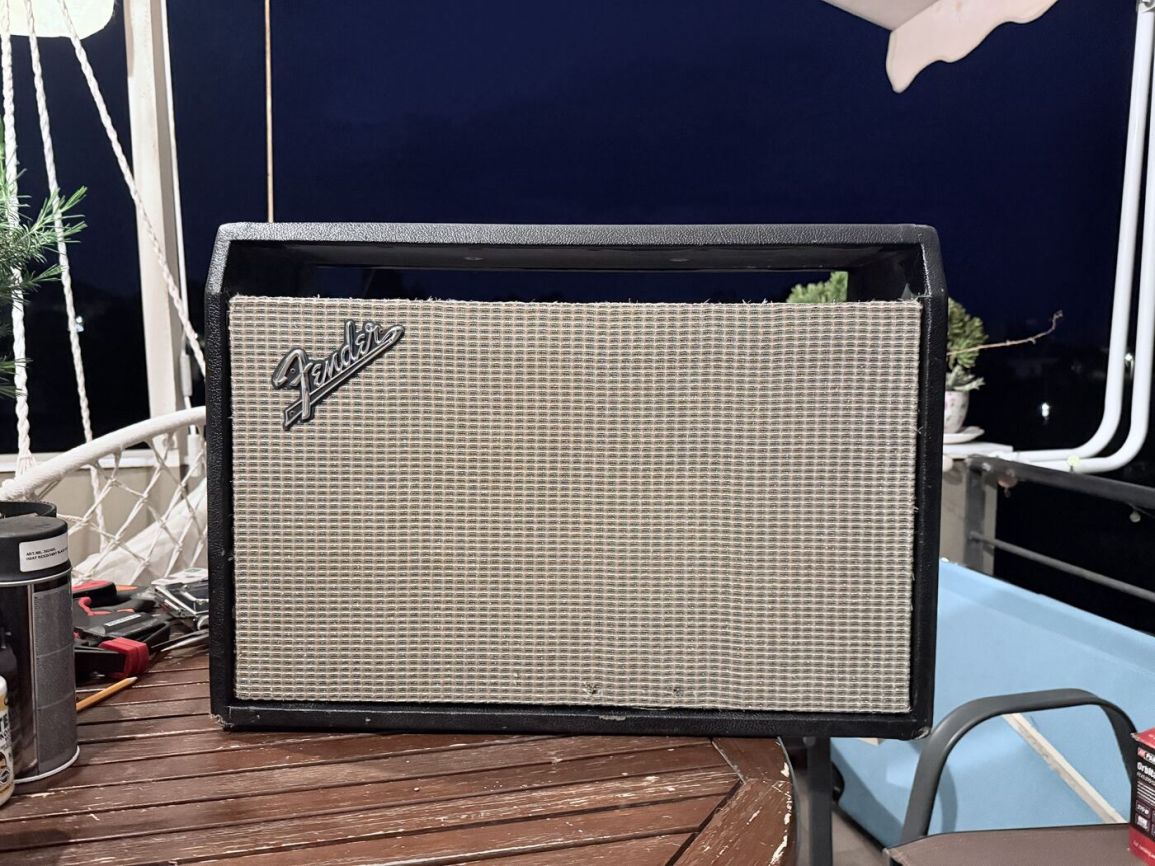 Cabinet reassembled with the original grille cloth and badge in place
