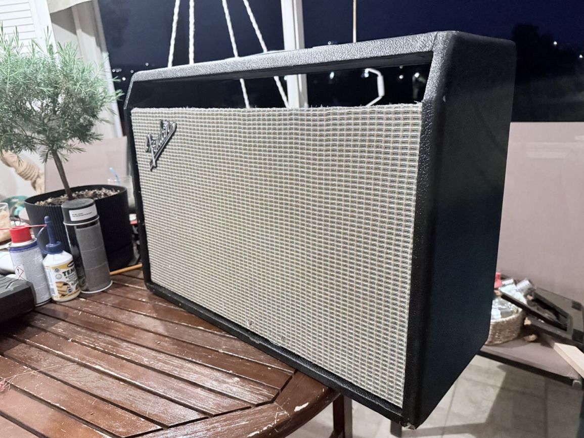 Angled view of the reassembled cabinet showing tight grille fit