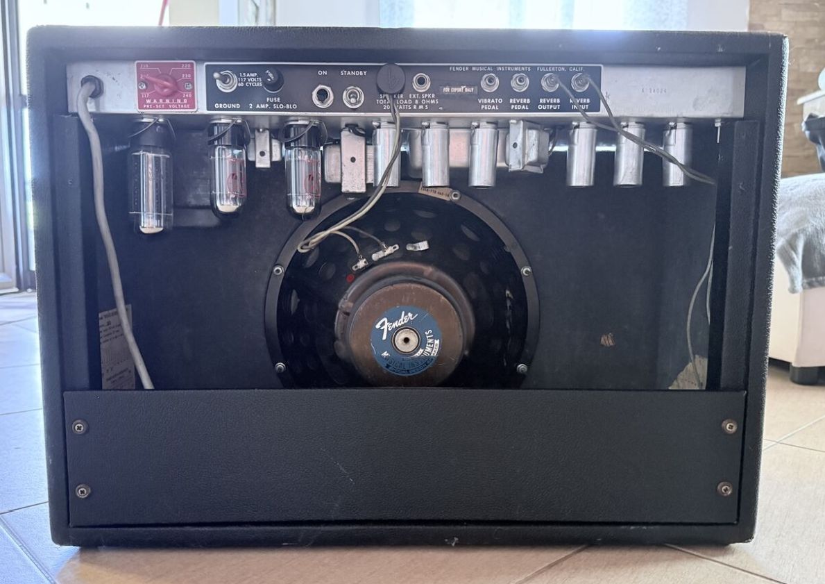 Restored back panel with tubes, transformers, and original speaker visible